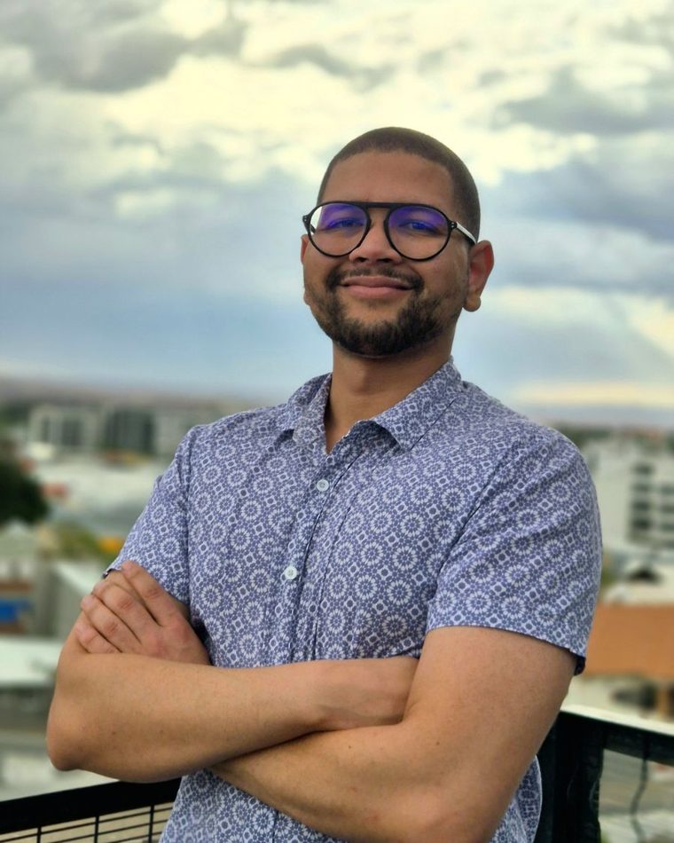 Christopher Van Wyk, founder of Zono Netwire, standing on a rooftop